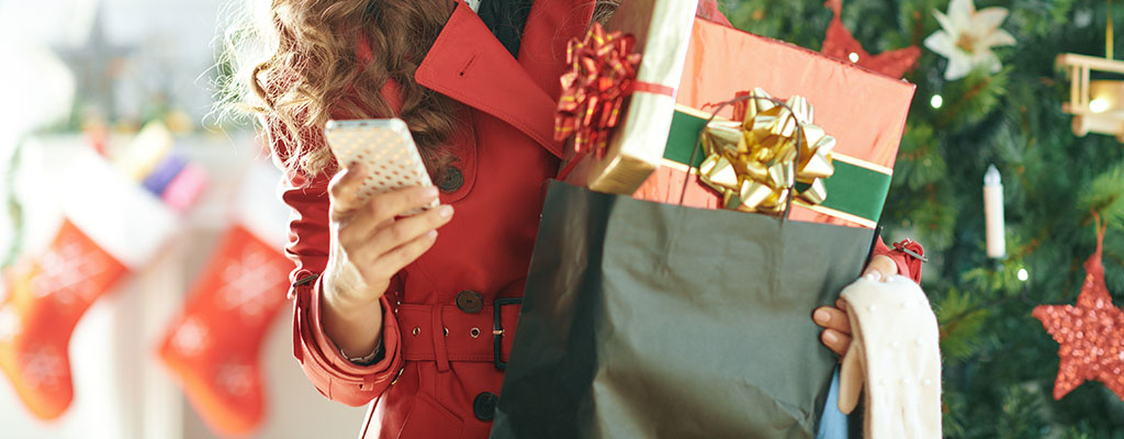 woman with presents and phone